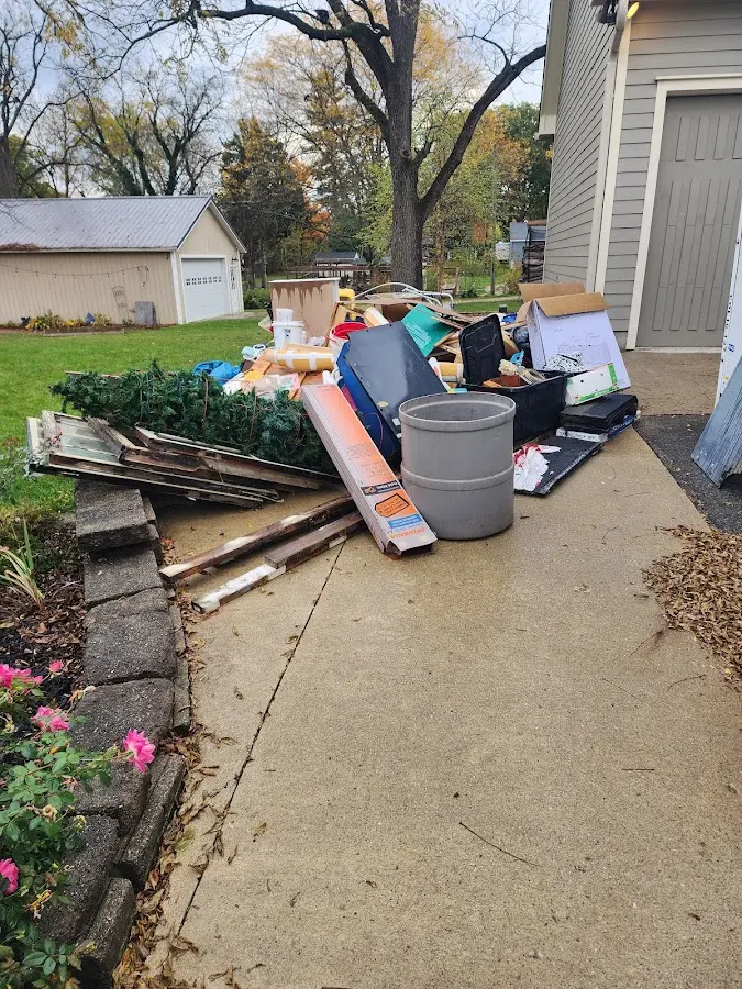 Dumpster being loaded with debris for 3 Yard Dumpster Rental in Fair Lawn